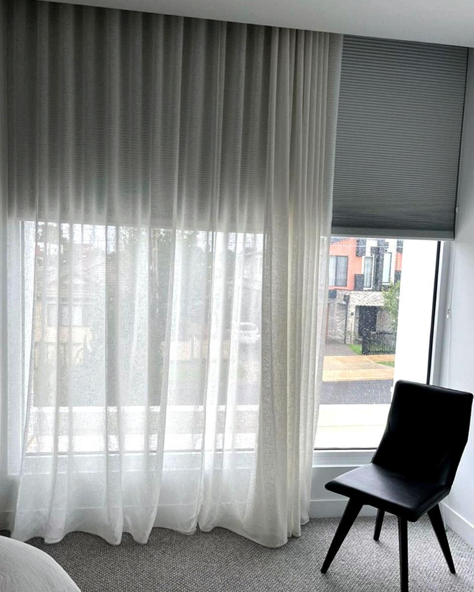 Sheer curtains and honeycomb blind in a Melbourne bedroom